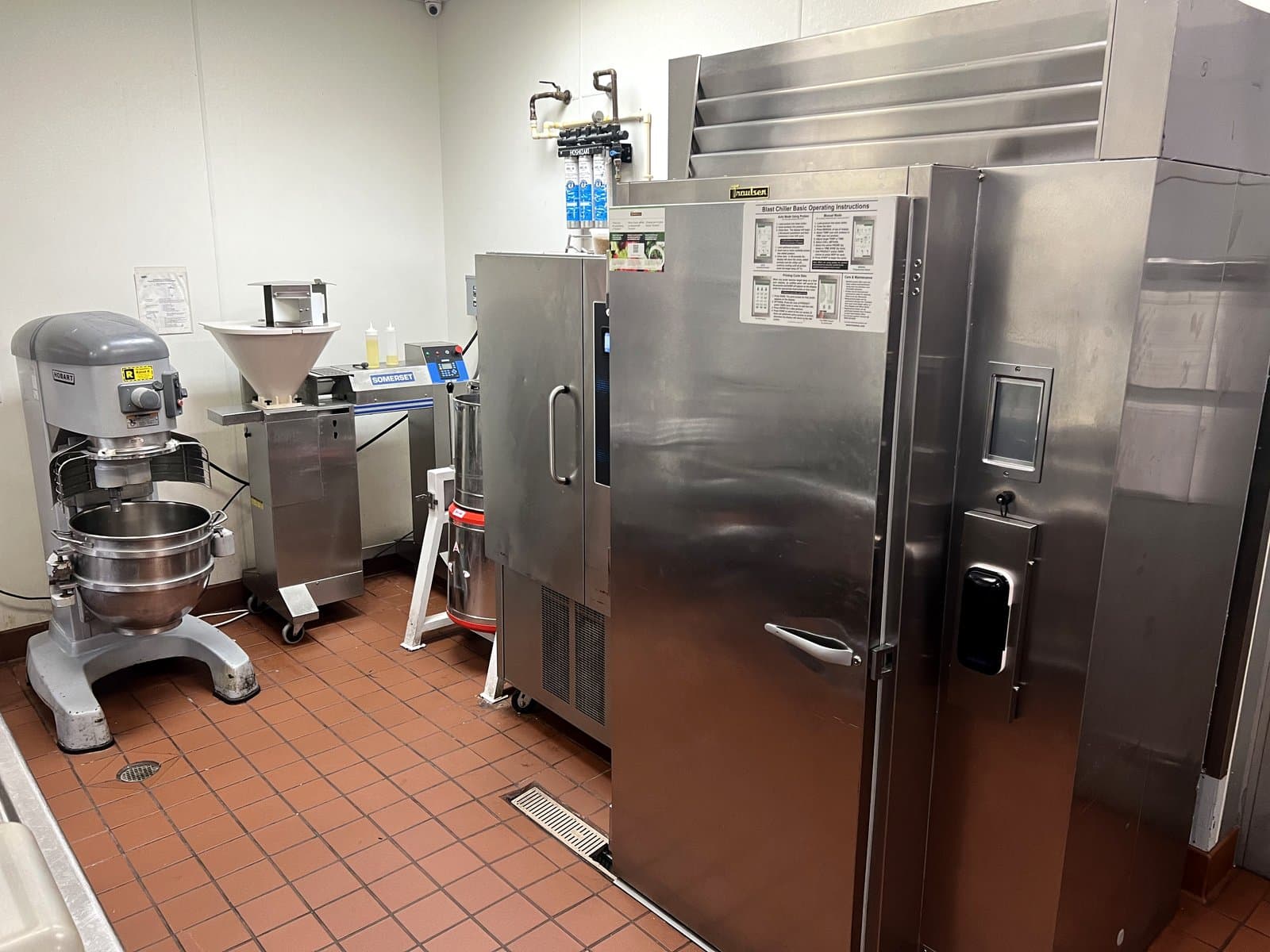 Industrial dough mixer and prep equipment at Mint Indian Bistro catering kitchen