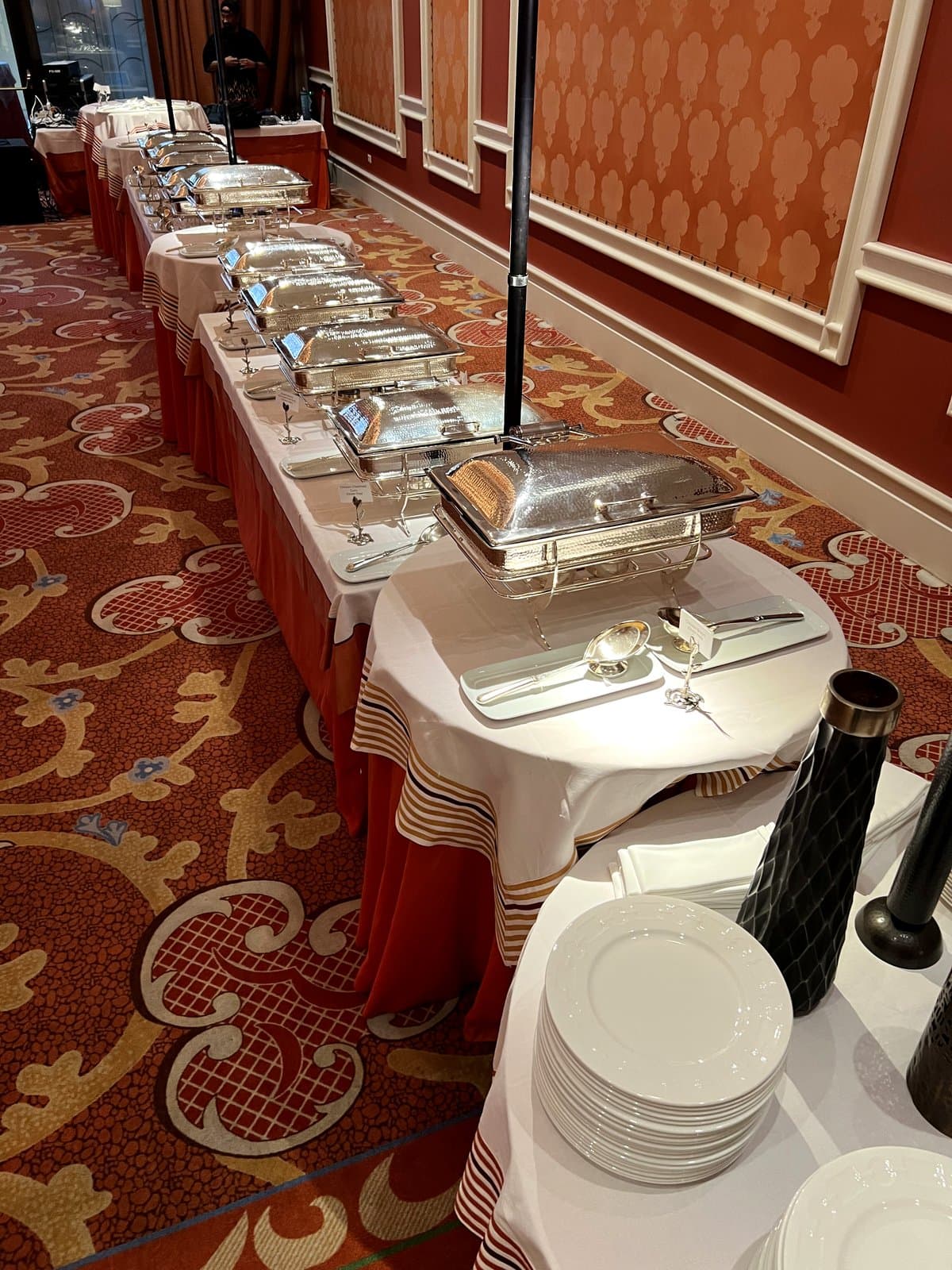 Row of silver chafing dishes at a formal Mint Indian Bistro catering event