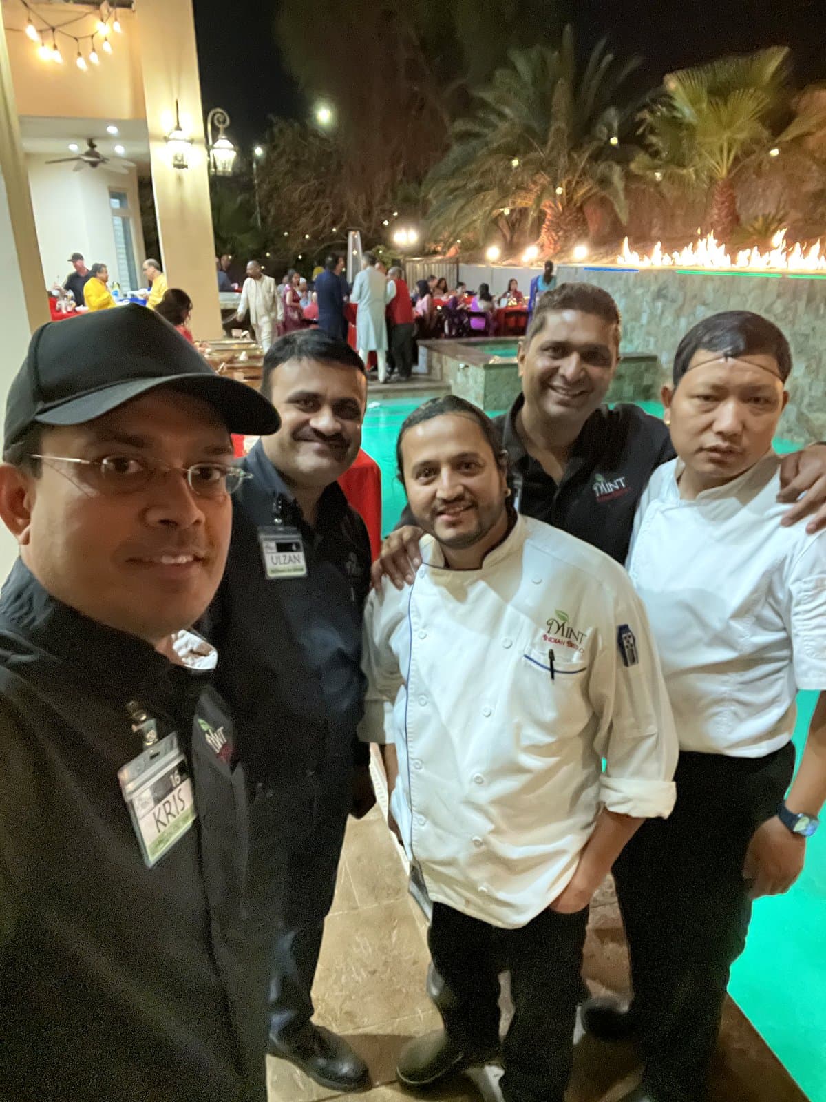 Mint Indian Bistro catering team at an outdoor evening event