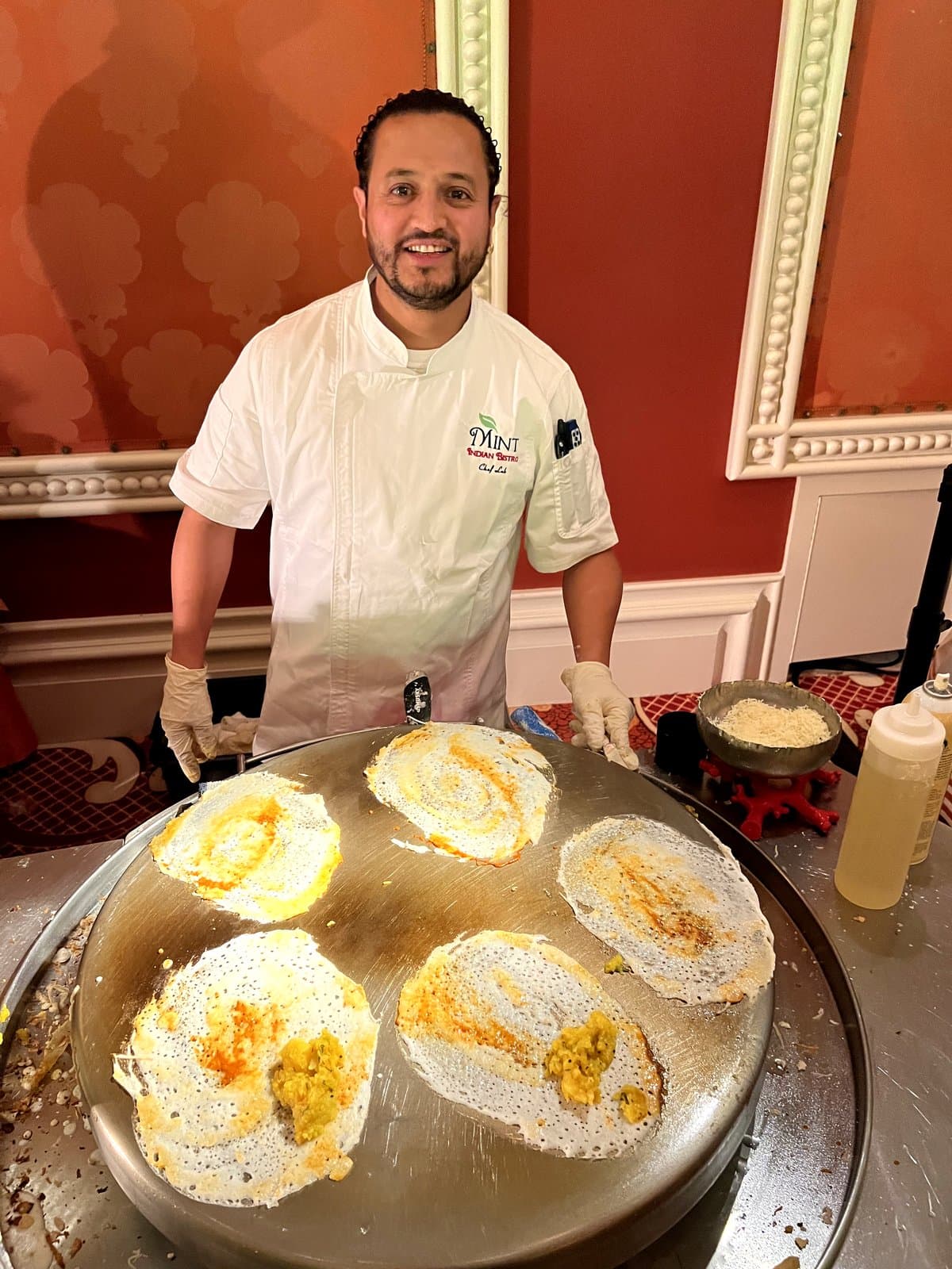 Mint Indian Bistro chef preparing dosas at a live catering station