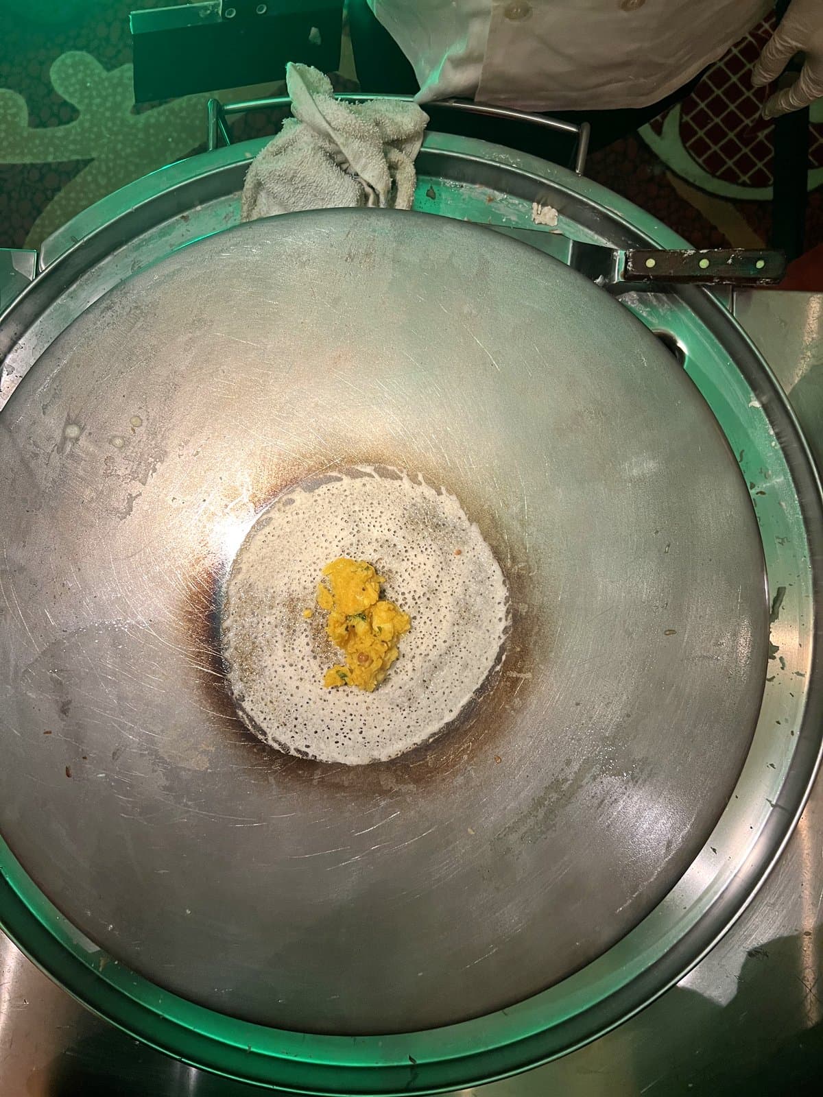 Masala dosa being prepared on a live griddle at Mint Indian Bistro catering