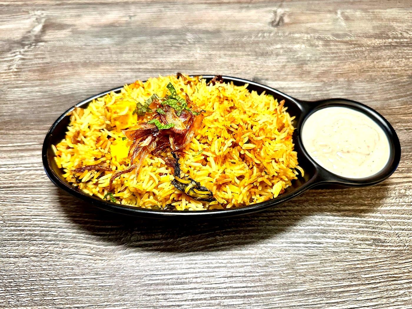 Chicken Boneless Biryani — Mint 10 signature at Mint Indian Bistro